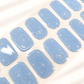 Aqua Twinkle baby blue semi-cured gel nail strips with subtle shimmer, twinkle and ribbon details by LAVU