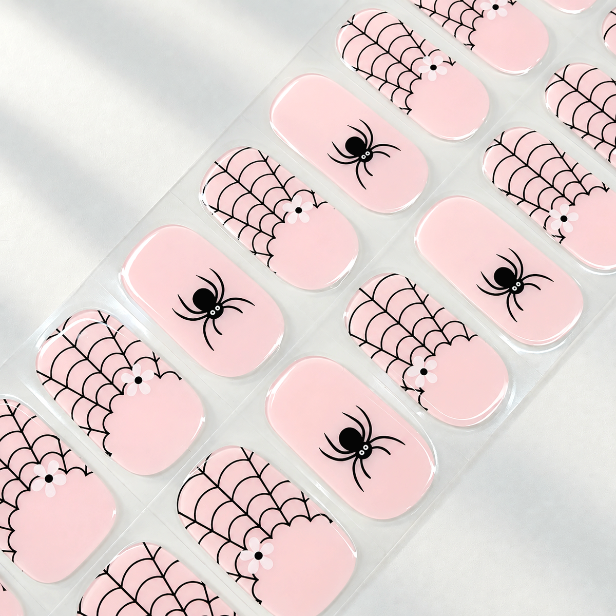 Pink Web pink spiderweb and ghost Halloween semi-cured gel nail strips by LAVU